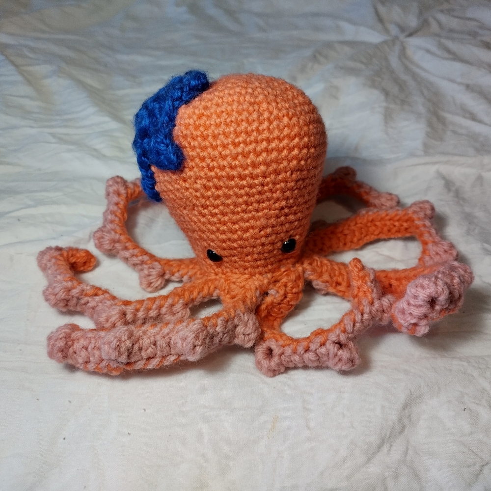 Crochet orange octopus with blue starfish